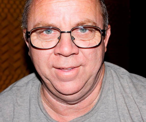 Faron Collins in metal rim glasses